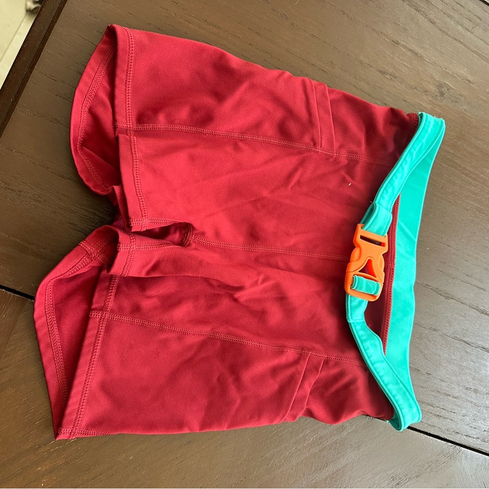 Fabletics Red Athletic Shorts with Teal and Orange Accents